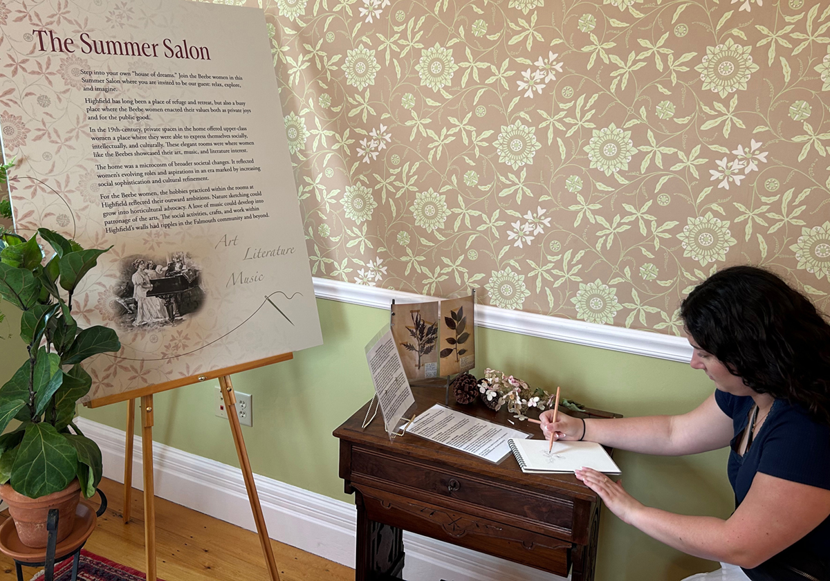 A woman drawing in a historic room