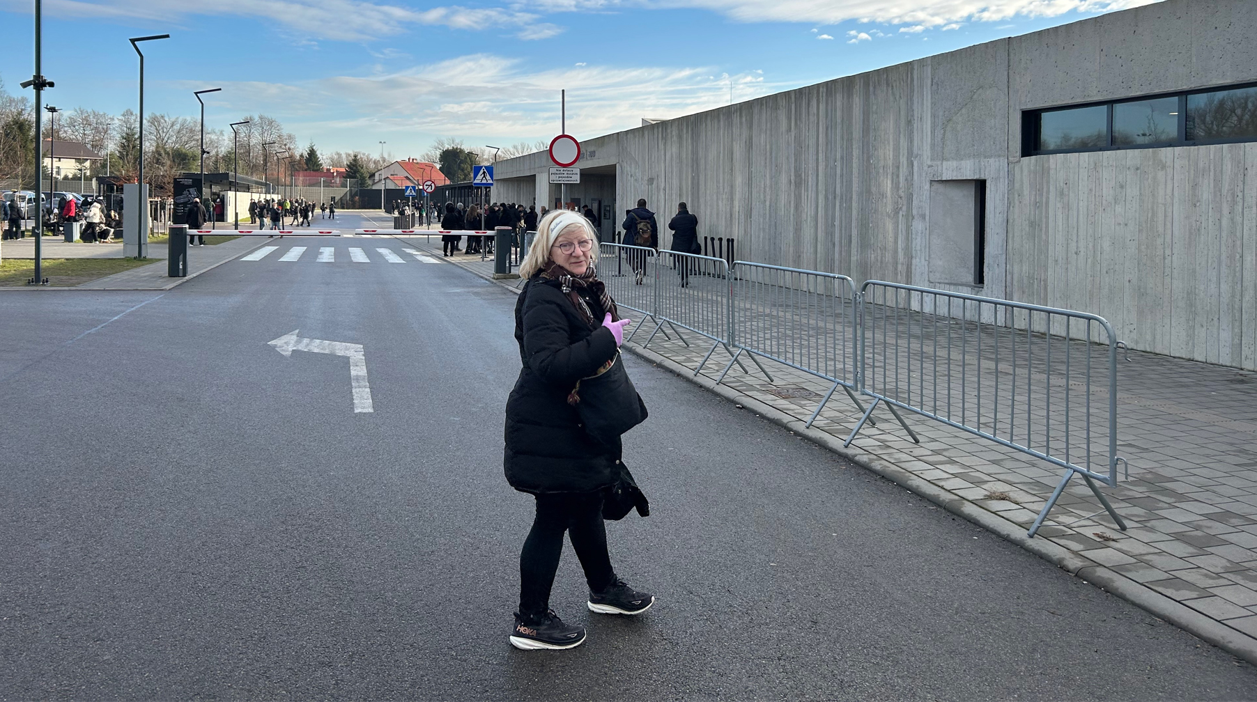 My partner Carol Lieb at the entry to Auschwitz-Birkenau State Museum. This is it, we traveled 4100 miles to get here!