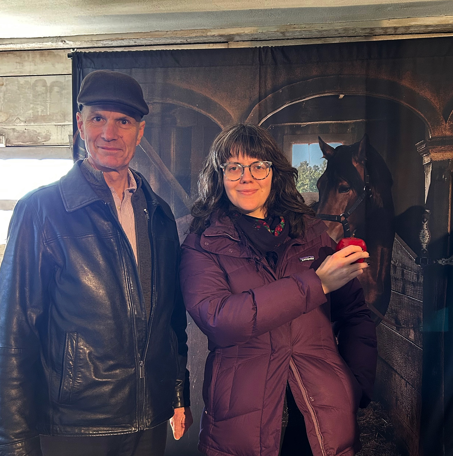 Edward Malouf and Lydia Harrington at the Wadsworth Stable in front of a mural of George Washington's horse which was reportedly stabled there.